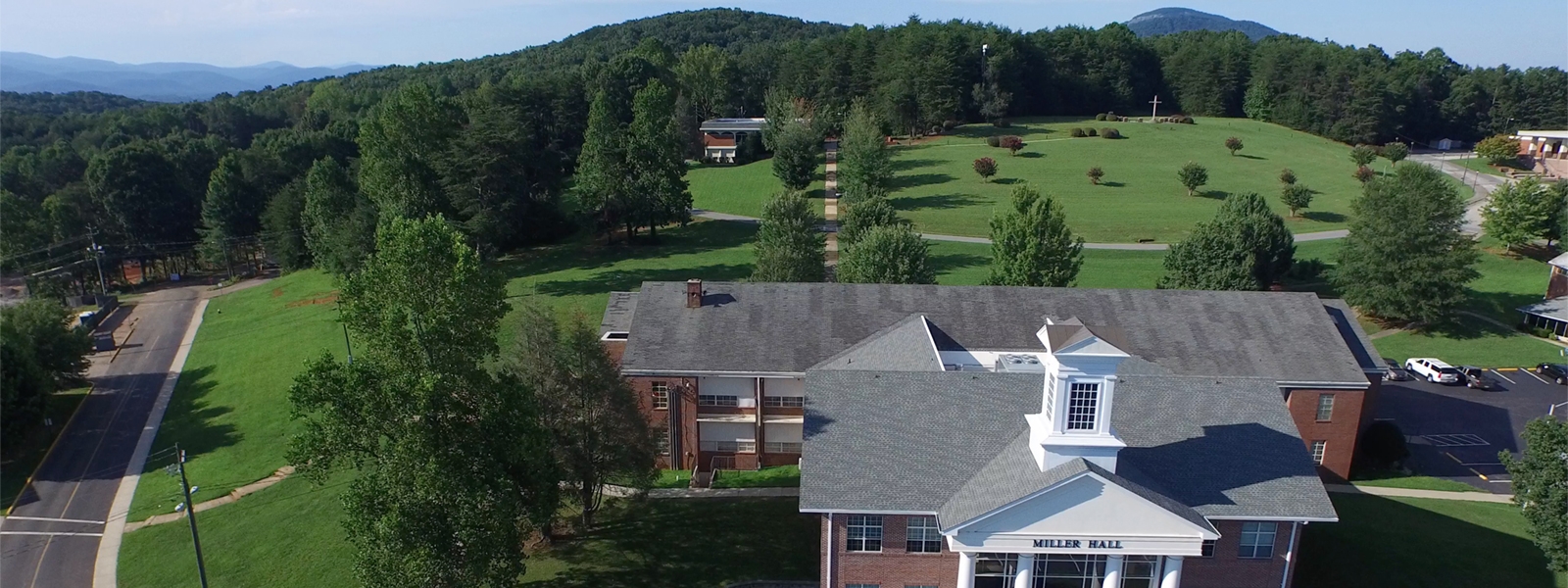 Aerial view of campus showing Miller Hall and the cross