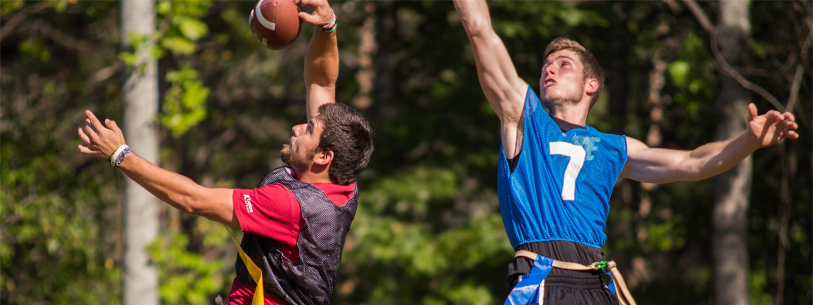 Male students playing intramural football