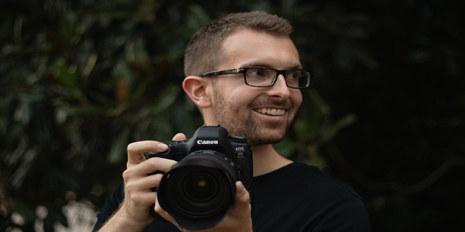Eric Robbins holding camera