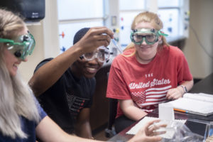 TMU students participate in biology lab.